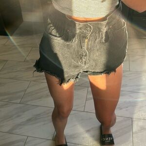 Black cinched jean shorts